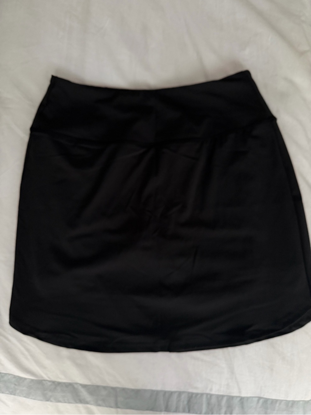 Black athletic mini skort with Smooth Waistband and pockets for golf/pickleball